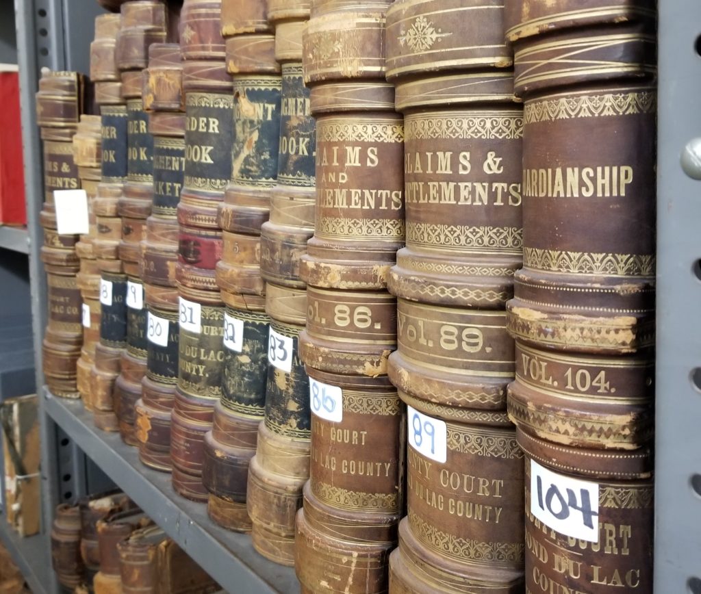 Historic volumes on bookshelf